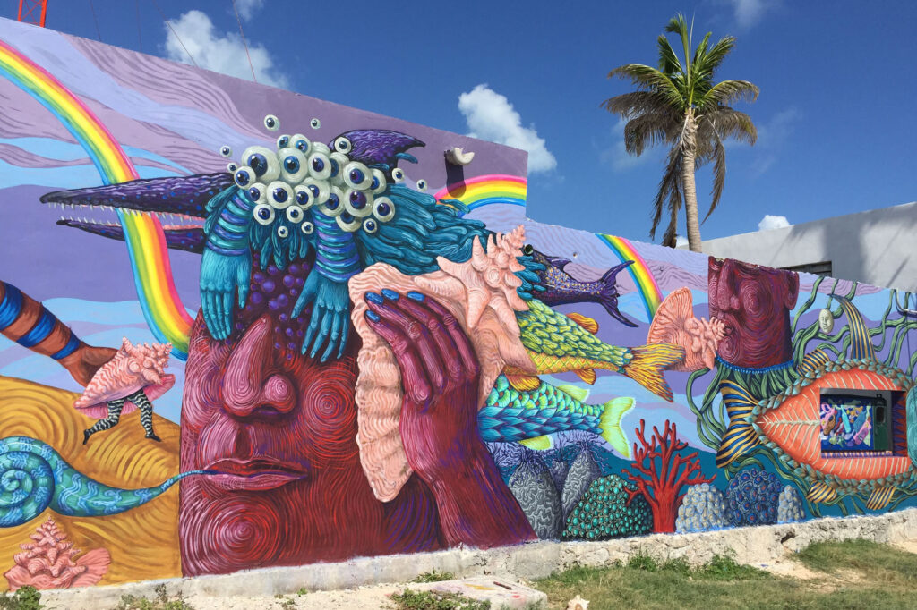 Danae sea wall murals isla mujeres
