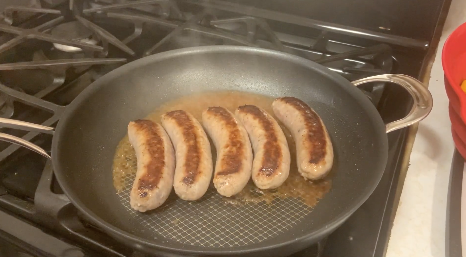 sausage and peppers brown cooking frying pan