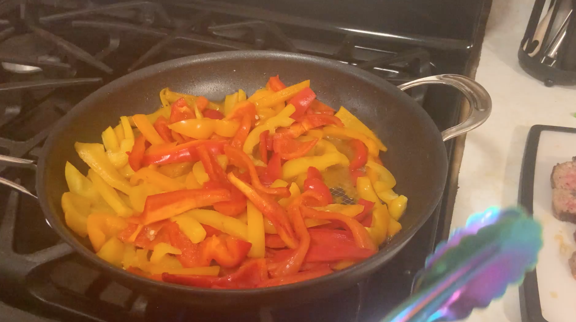 sausage and peppers cooking frying pan